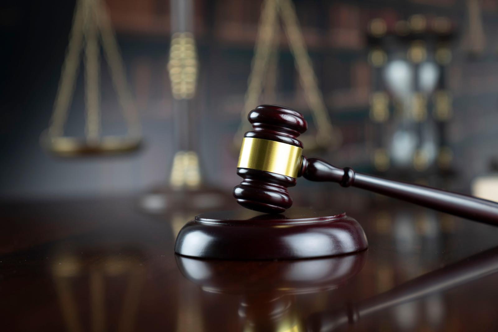 Judge gavel and scales of justice on a desk